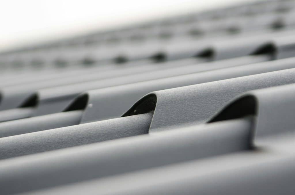Gray metal sheets on a roof in Dallas, TX